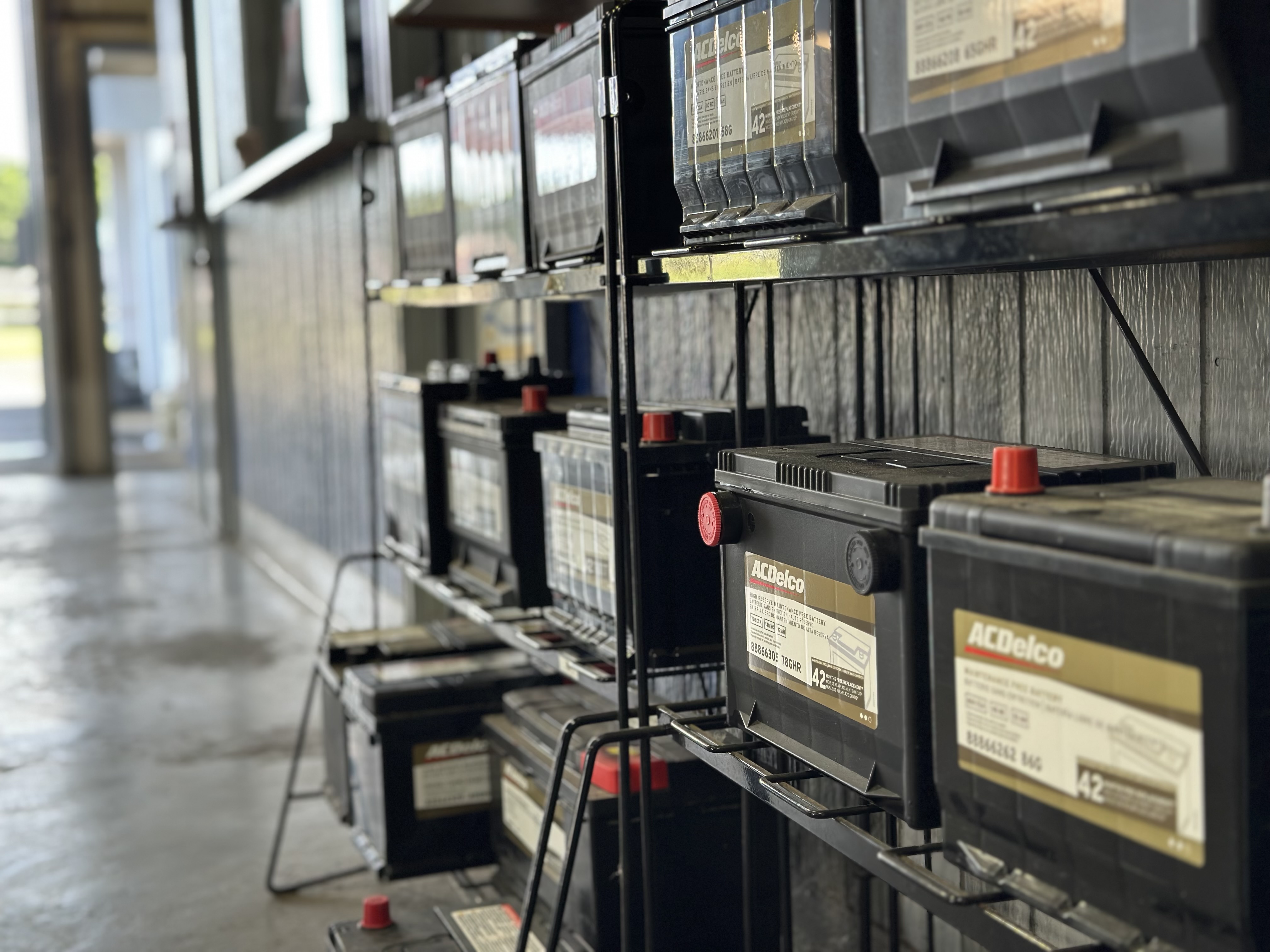 Wall of ACDelco batteries in stock at Snider Auto Care